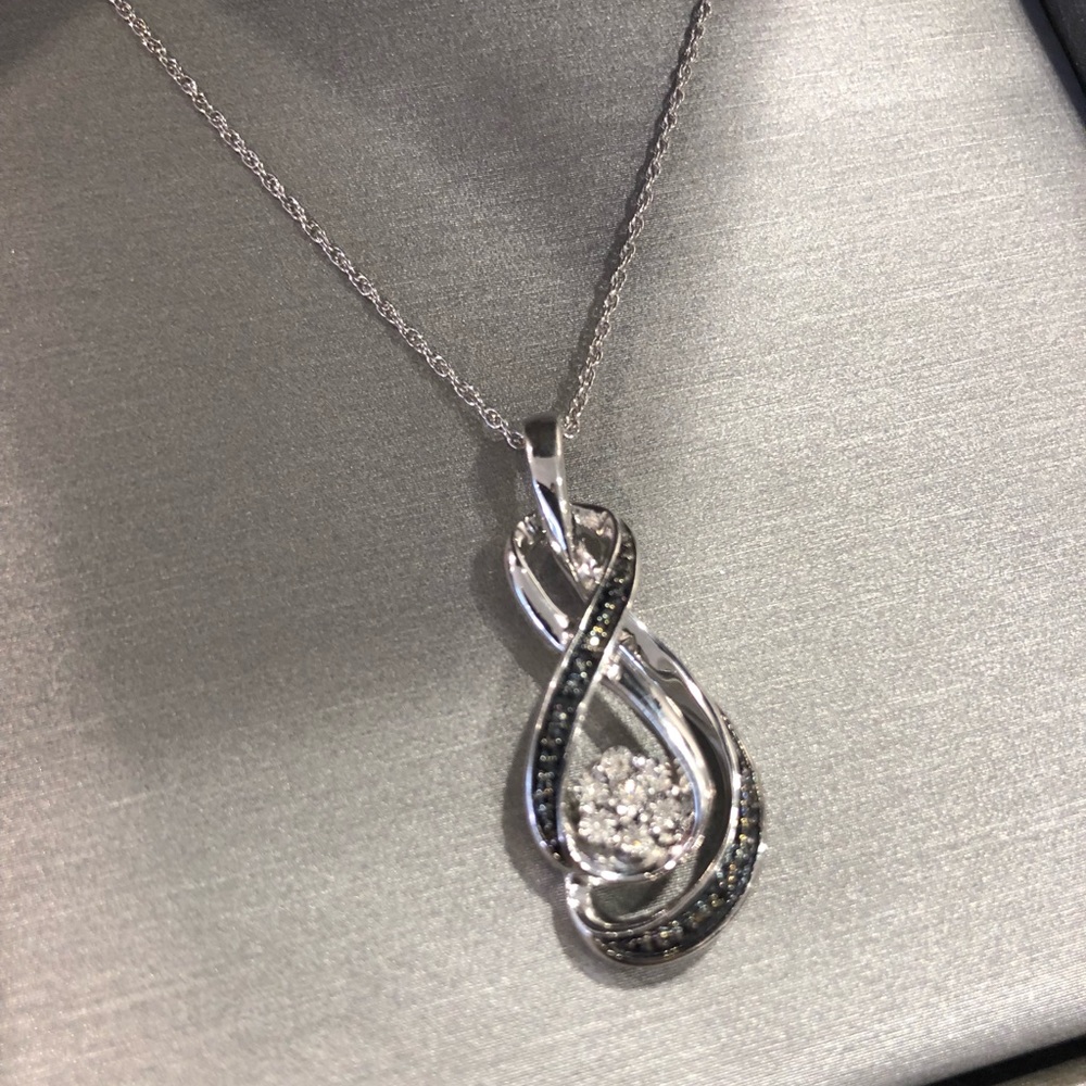 Silver pendant with diamond accents
